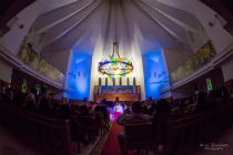 Viewed from the back of the cathedral with the colourful chandelier above the performers