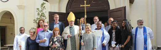 The candidates pose for a group photo outside the cathedral with Bishop Michael