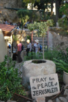 A sign saying Pray for the Peace of Jerusalem in the Garden Tomb