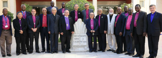 The Primates join together outside the conference centre