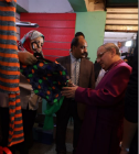 Bishop Mouneer is shown one of the garments that has been repaired