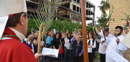 The Bishop and Fr Faiz leading worship in the grounds of St George's Church