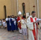 Fr Faiz leading the procession followed by the server, Bishop Michael and the congregation
