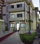 The red carpet leading to the front of the school building at dusk