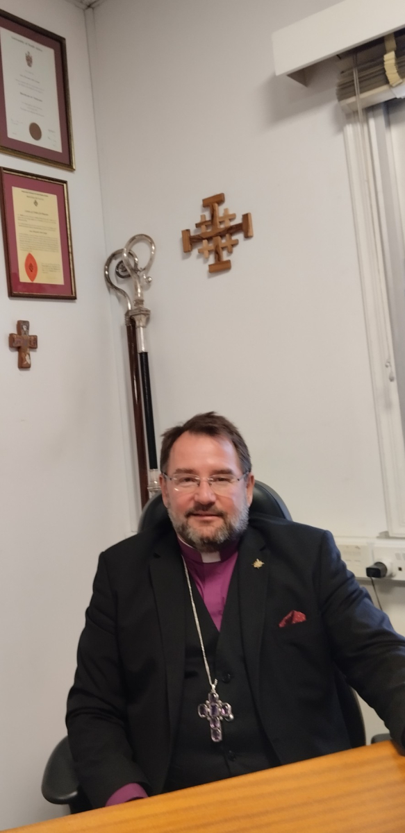 Bishop Sean at his desk