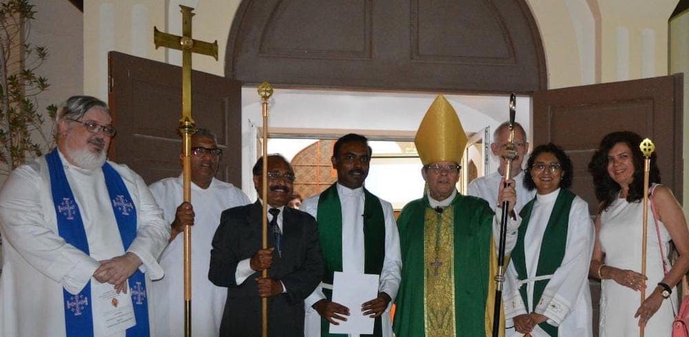 Archbishop Michael, Revd Dr Franklins and Interim Priest Revd Deborah Moorgas with others in the cathedral