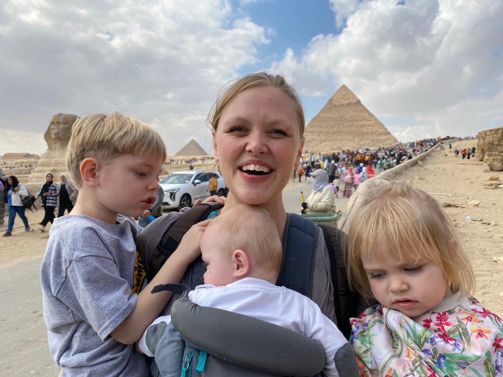 Kristin pictured by the Pyramids with her three small children