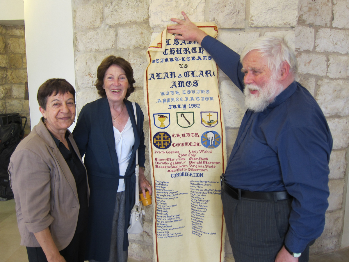 Alan Amos receiving an embroidered hanging from All Saints Church in appreciation of his time there in 1982