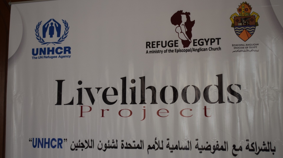The Livelihoods project banner, in English and Arabic showing the U.N.H.C.R. and Anglican Church in Egypt's logos