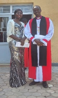 Bishop Jeremiah standing next to his wife Nyachom