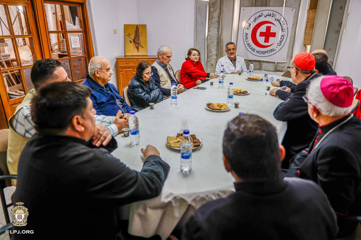 The Cardinal meets with staff and workers at the hospital