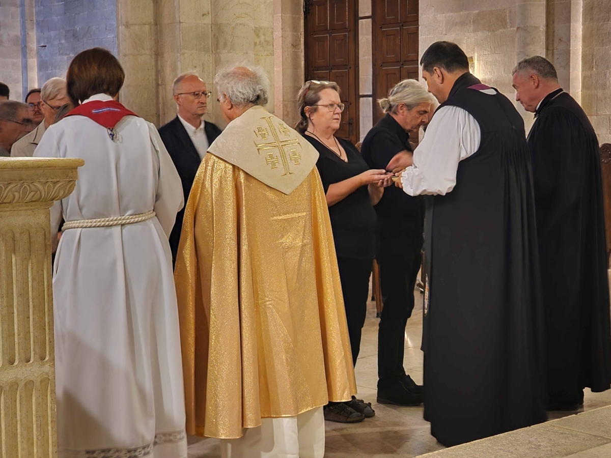 disributing communion at the Redeemer Church