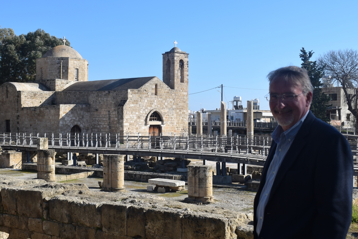 Paul stands in the gorounds of Agia Kyriaki church