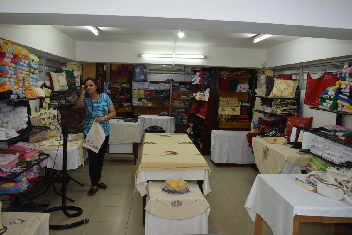 The well stocked shelves of the linen section in the Cathedral shop. Plenty of embroidered table cloths, tea towels and cushions to choose from in a wide variety of colours and designs