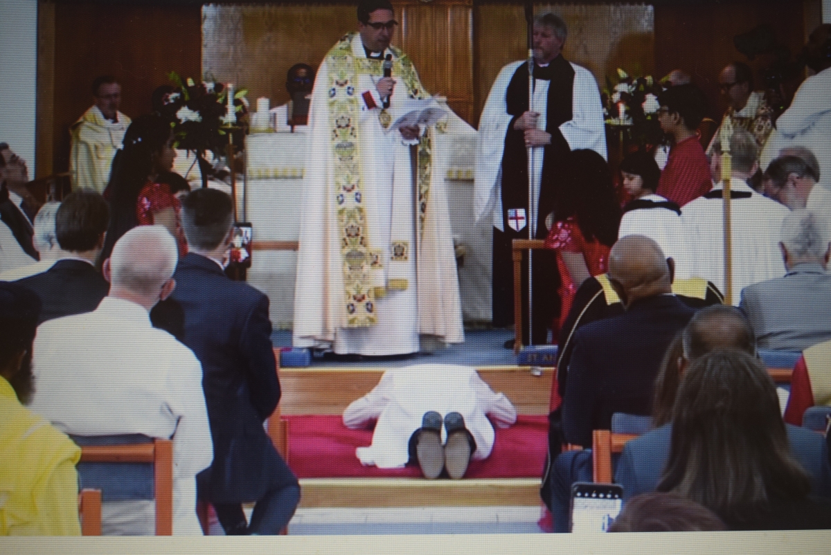 Sean prostrates himself as the Archbishop invokes the Holy Spirit