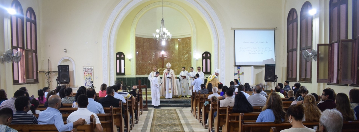 The view from the back of a church in the middle east whilst a service is taking place 