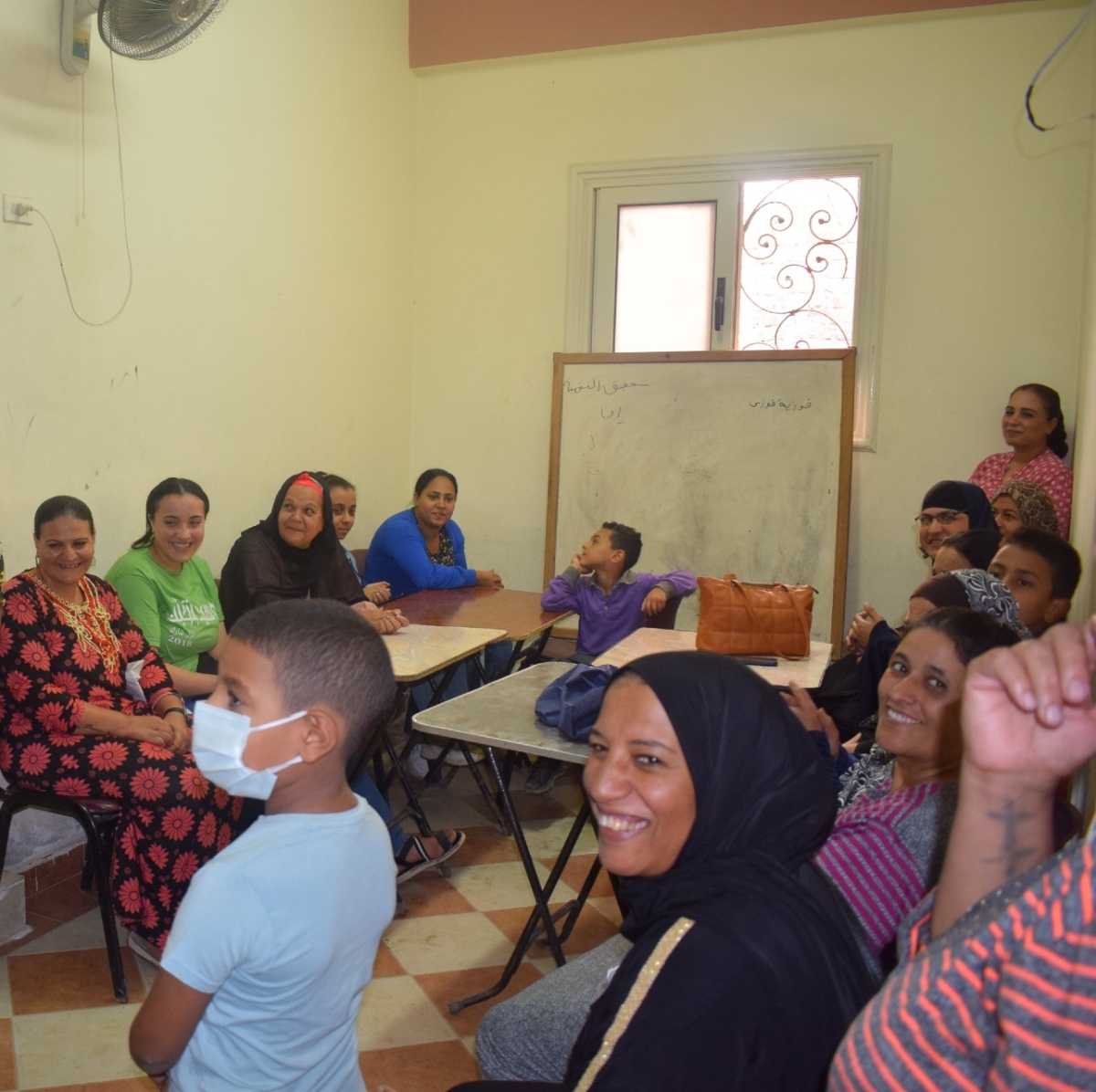 a group of mothers and their children at the centre