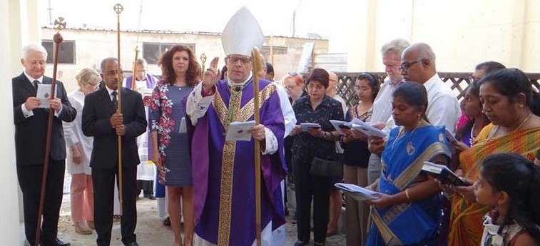 The Bishop blesses the new building in front of the congregation