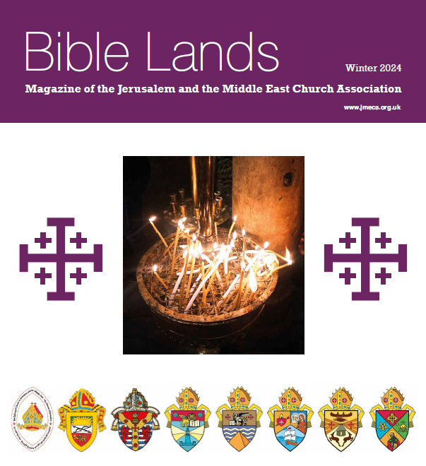 Candles burning in a golden glow as pictured on the cover of the magazine