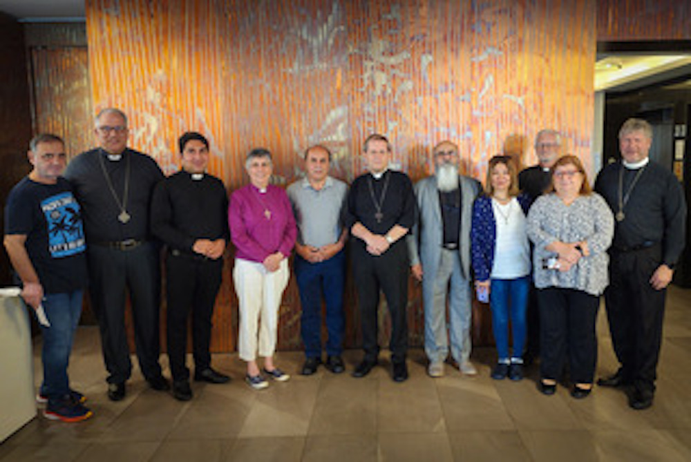 Group photo of guests with Archbishop Michael