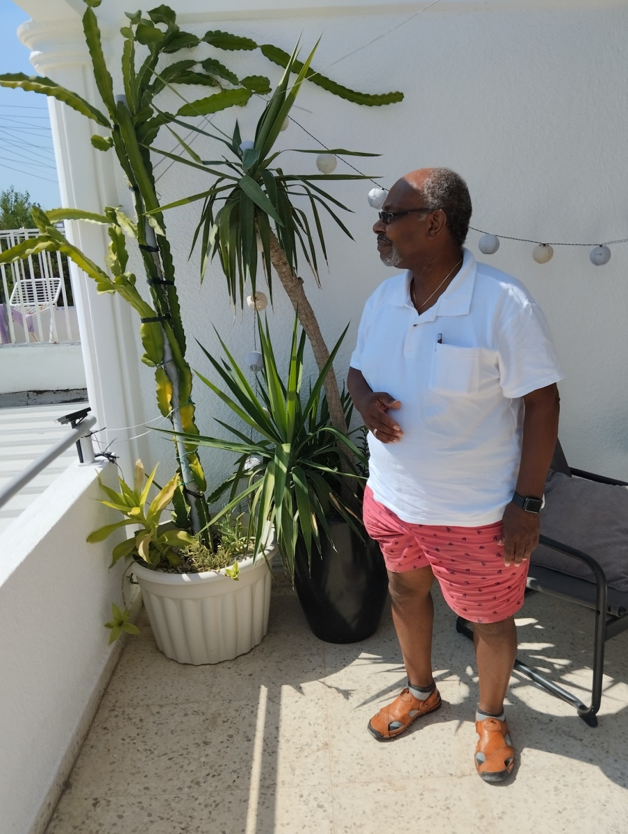 Fr Ken at a property in Cyprus looks out in the direction of the sea