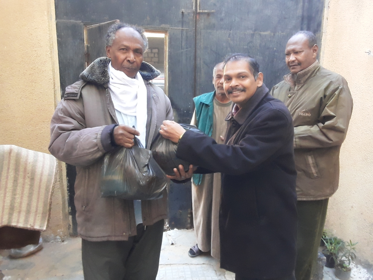food parcel being handed to Sudanese refugees