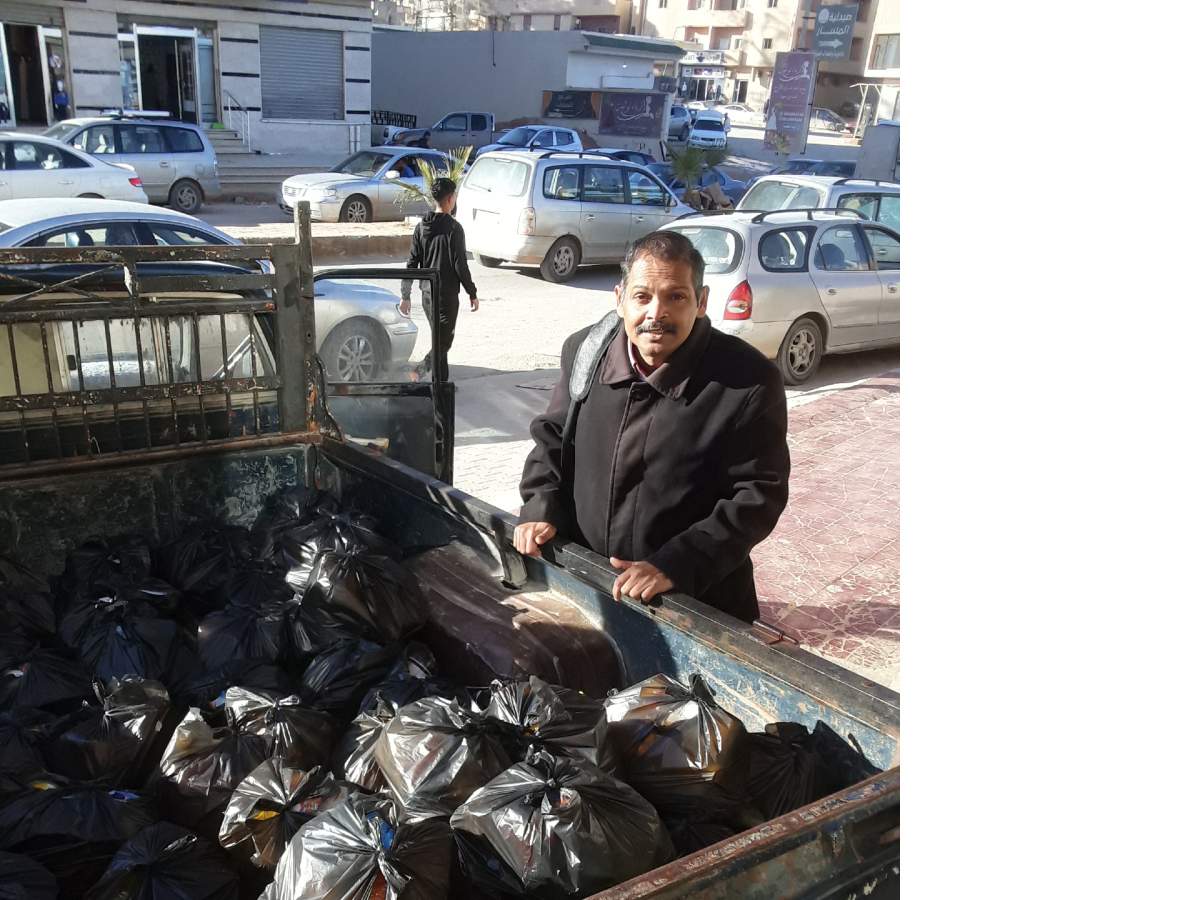 A pick up truck carrying food parcels