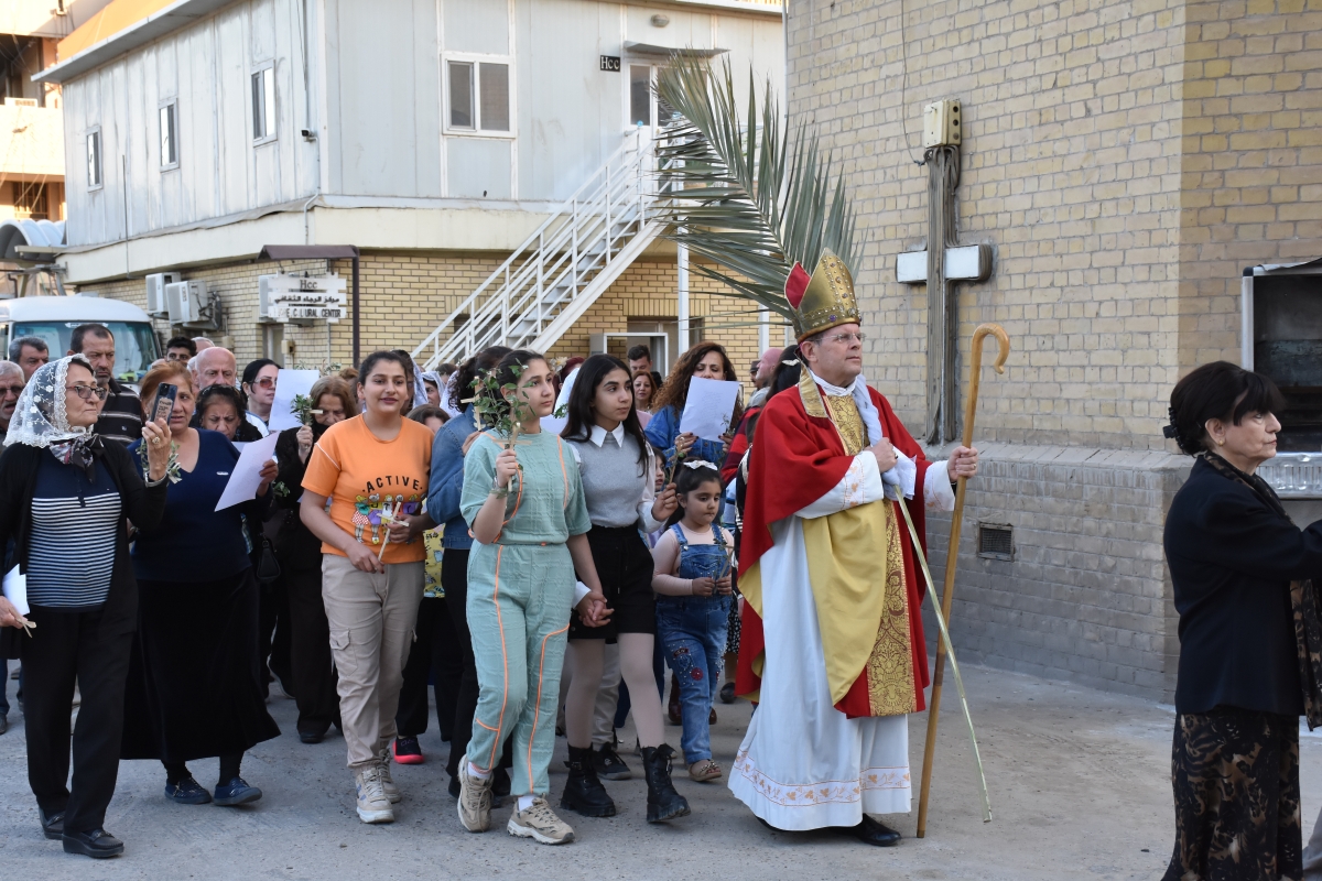 The people of Cyprus process through the streets carrying small palm crosses with palm branches following the Archbishop