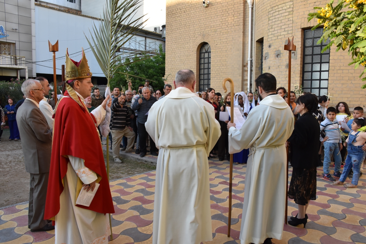 The people of Cyprus process through the streets carrying small palm crosses with palm branches following the Archbishop