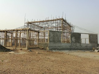 The building so far with walls but no roof