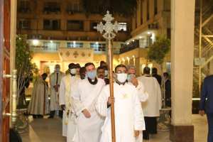 The church leaders being led through the church