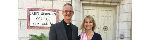 Richard Sewell with his wife at the door to St George's College in Jerusalem