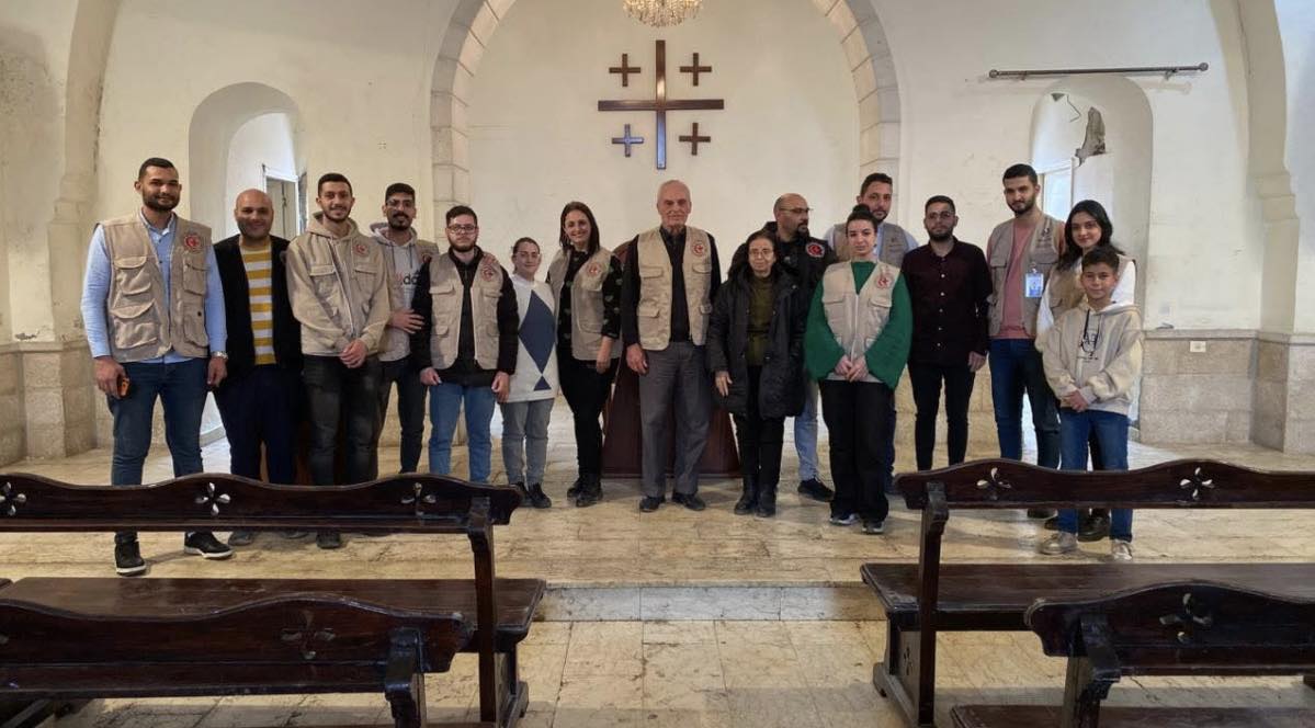 Christian workers pose in St Philip's Church