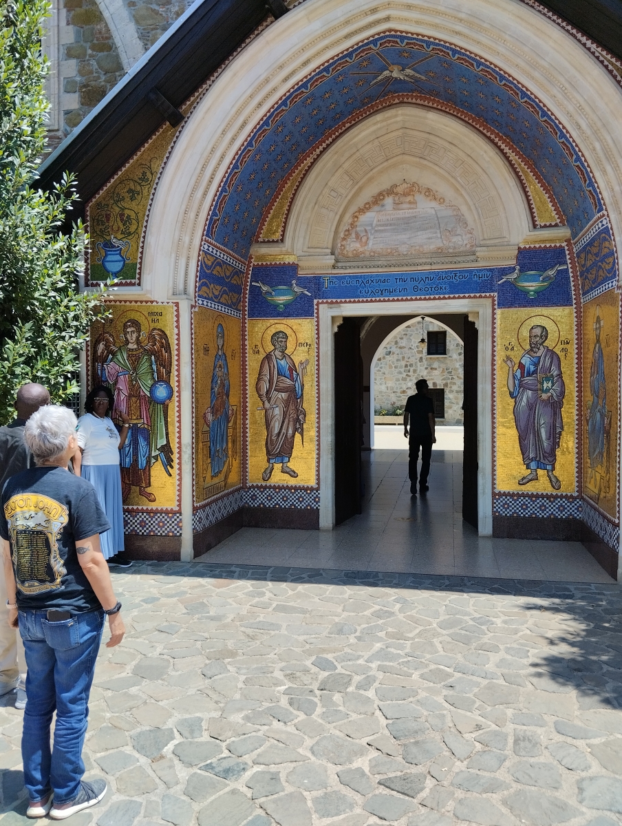 A student contemplates the entrance to Kykkos monastery