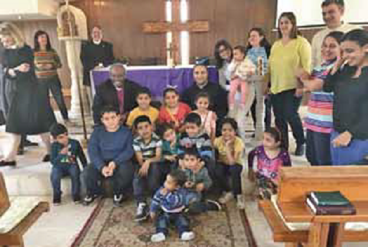 Bishop Curry with the children at St Paul's in Amman